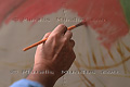 Main de Fernando Botero en train de peindre
